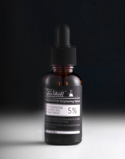 Teashell Niacinamide serum dropper bottle product shot black background